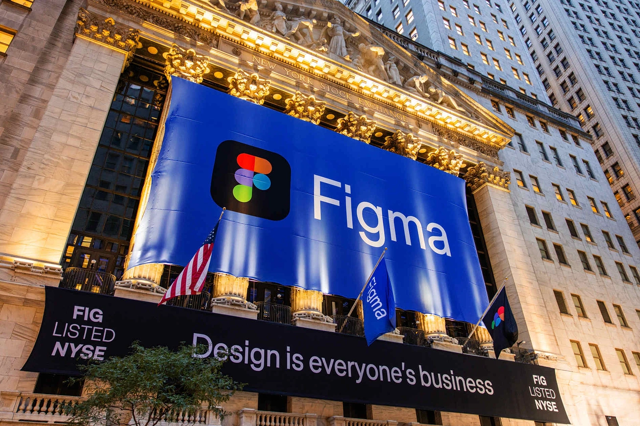 Figma's banner draped across the New York Stock Exchange facade reading "Design is everyone's Business"